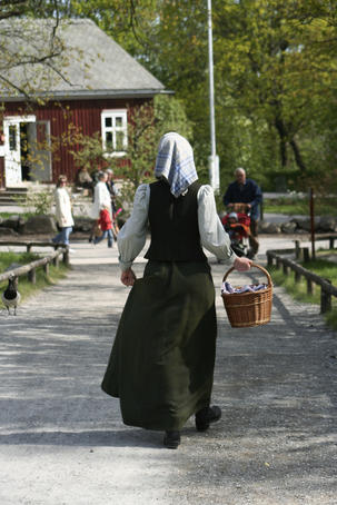 Woman in period costume at Skansen.