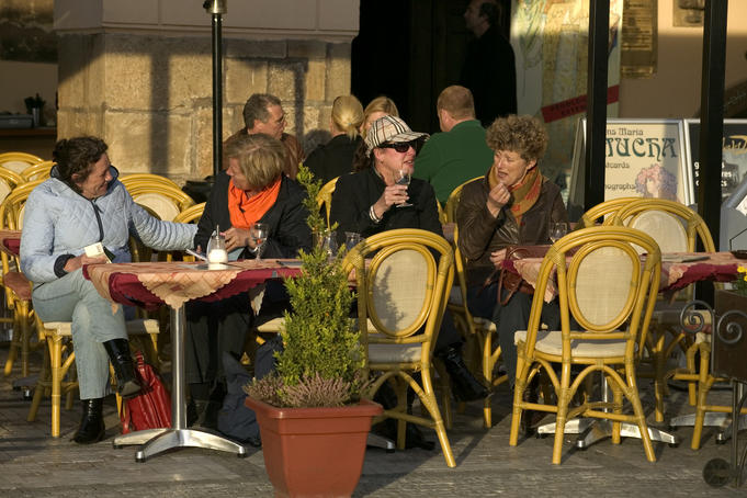 People drinking outside a cafe, Old Town Square.