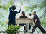 People doing morning exercises beside Hoan Kiem Lake.