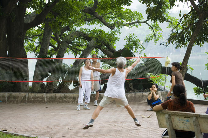 Morning badminton game beside Hoan Kiem Lake.