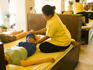 Thai masseuse at work, Wat Po, Ko Ratanakosin.