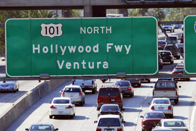 Freeway sign and traffic, Downtown.