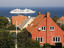 Houses with MS 'Europa' offshore, Gudhjem.