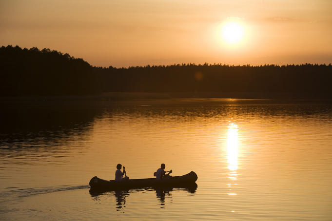 Canoe at sunset on Lake Zotzensee, Mecklenburgian Lake District.