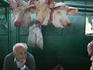 Butcher and pig heads in the old market.