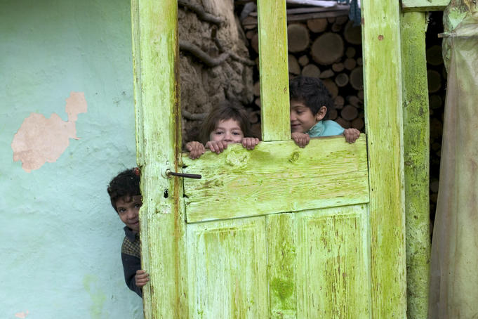 Gypsie children playing in their house, Transylvania.