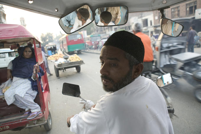 A rickshaw driver looks for customers to take to The Gold Market, Shai Mahala.