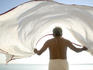 Man dries his lungi in the winds by the Ganges.