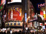 Colourful night-time lights of Shibuya's vibrant shopping precinct.