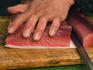 Cutting up a tuna steak, Tsukiji Central Fish Market.