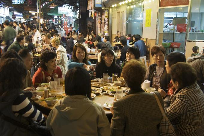Alfresco dining at a restaurant around the Temple Street Night Market.