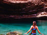 Woman swimming in Bimmah Sinkhole.