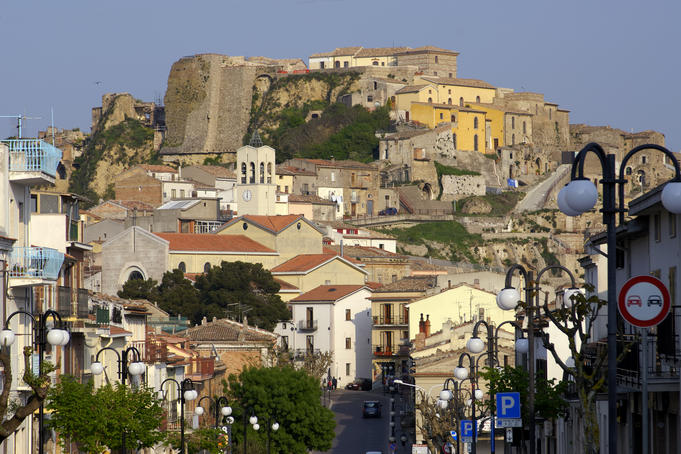 Main street of town with buildings rising behind.