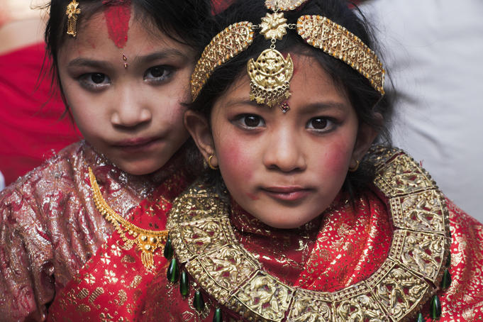 Portrait of two girls dressed for Kumari (living goddess) festival.