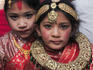 Portrait of two girls dressed for Kumari (living goddess) festival.