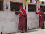 Nuns walking round base of Bodhnath Buddhist stupa, Lhosar Tibetan and Sherpa New Year Festival, Bagmati.