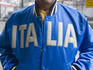 Man wearing blue Italia jacket.