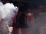 Worshipper with handful of incense sticks at Darma Jaya Temple during Chinese New Year.