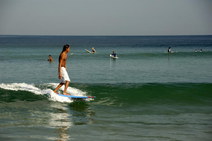 Longboarder on small wave.