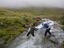 Walkers crossing stream on Loft Beck.