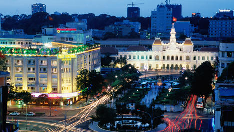 Overlooking the People's Committee Building and Rex Hotel at dusk.
