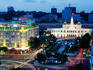 People's Committee Building and Rex Hotel at dusk.