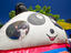 Young girl looks out from inside a giant inflatable panda ride.