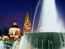 Water fountain on Plaza de la Liberacion with 17th century Cathedral in distance.