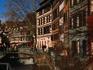 Houses hug the banks of a canal in the so-called Petite France - Strasbourg, Alsace