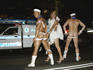 Risque participants in front of a police car, Gay and Lesbian Mardi Gras Parade.