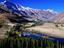 Gilgit River cutting through the cultivated valley with mountains in the background, Phander.