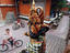 Young boys riding their bicycles outside a temple.