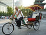 Rickshaw and driver.