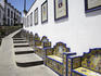 Tile work with other town's coat of arms, Firgas.
