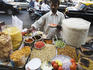 Vendor sells bhelpuri on the street.