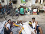 Group of people begin to wake up, Colaba.