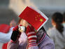 Tourist taking photograph at Tian'anmen Square.