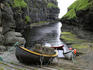 Boats at natural harbour at Gjogv.