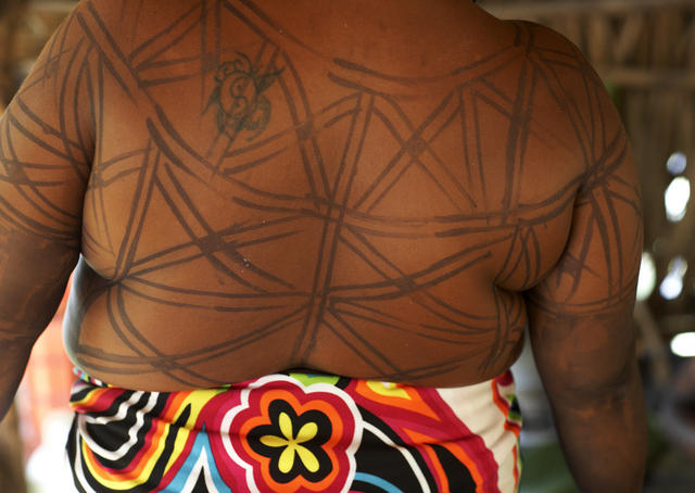 Embera girl painted with jagua fruit juice, Rio Chagres.