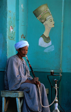 A local gentleman smoking a hookah, a nargile or even a shisha in Esna (Isna).