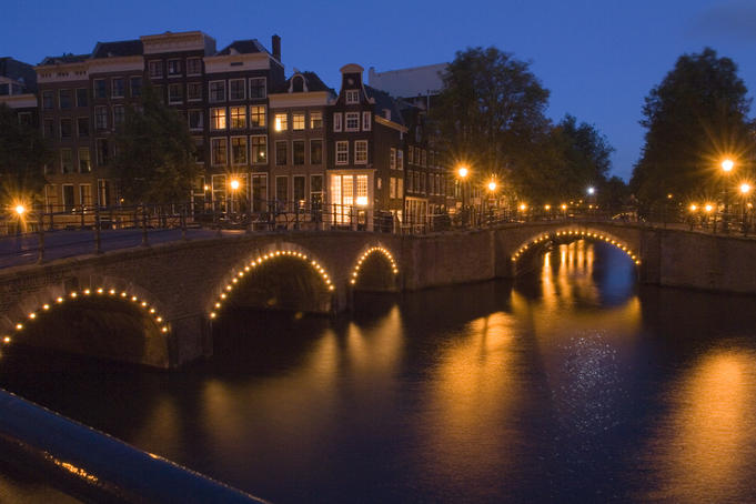 Lights along canal bridges at famous 'Golden Bend' in the city centre.