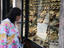 Women browses jewellery shop, Rue Semmarine