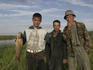 Portrait of Kazak men with fish.