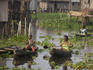 Women in canoes among stilt houses, Lake Nokoue near Cotonou.