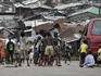 Kids playing football on a Kroo Town street.