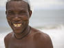 Smiling fisherman on beach at River No 2, Tokey, Freetown Pennisula.
