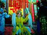 Chinese opera seen in a side street.