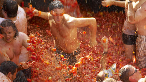 Tomato fight at La Tomatina tomato festival.