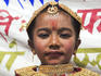 Child in traditional costume, Kumari (Living Goddess) Festival, Durbar Square.