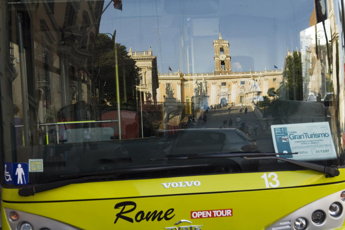Piazza del Campidoglio reflected in bus at sunset, Centro Storico area.